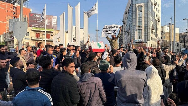 <div class="paragraphs"><p>People gather as they celebrate, after Syrian rebels announced that they have ousted President Bashar al-Assad, in Tripoli, northern Lebanon December 8, 2024.</p></div>