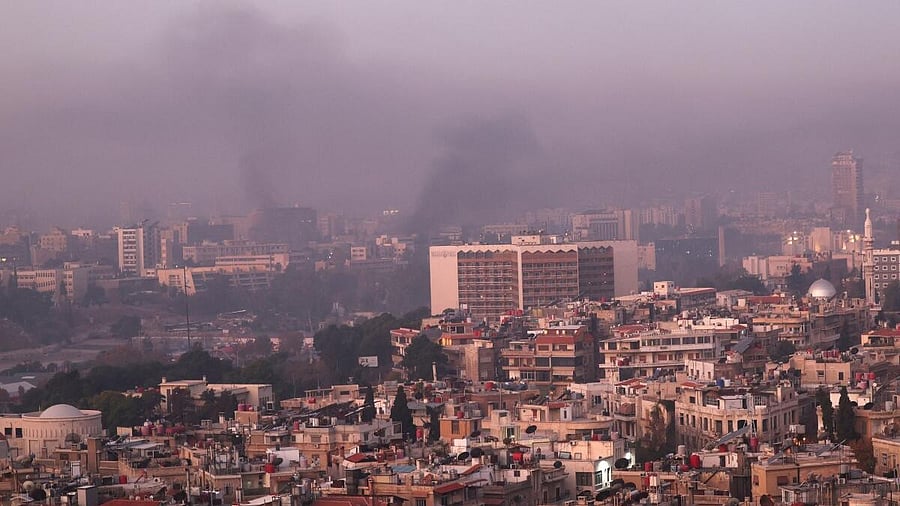 <div class="paragraphs"><p>Smoke rises, after Syrian rebels announced that they have ousted Syria's Bashar al-Assad, in Damascus.</p></div>