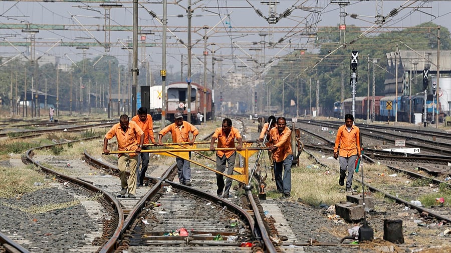 <div class="paragraphs"><p>Trackmen at work on a railway track in Ahmedabad</p></div>