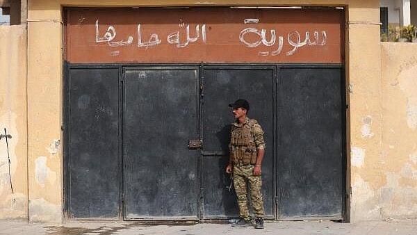 <div class="paragraphs"><p>A member of the Kurdish-led Syrian Democratic Forces (SDF) stands in Deir al-Zor, after US-backed alliance led by Syrian Kurdish fighters captured Deir el-Zor, the government's main foothold in the vast desert, according to Syrian sources, in Syria.</p></div>
