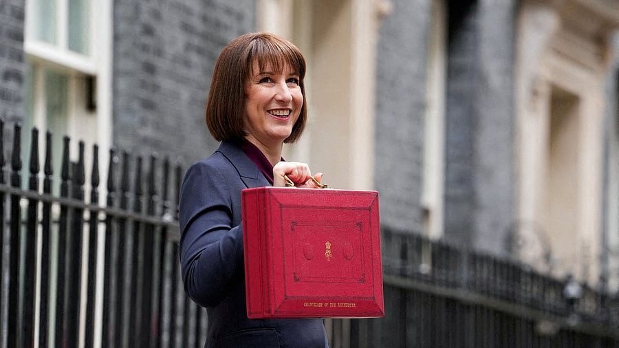<div class="paragraphs"><p>Britain's Chancellor of the Exchequer Rachel Reeves poses with the red budget box outside her office on Downing Street in London, Britain </p></div>
