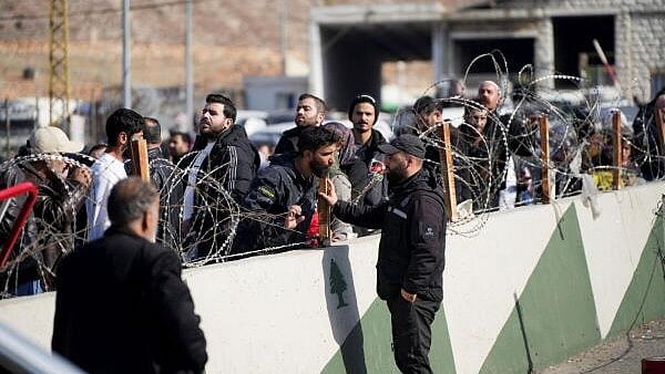 <div class="paragraphs"><p>People make their way as they attempt to cross into Lebanon at the Masnaa border crossing between the Lebanon and Syria, after Syrian rebels announced that they have ousted Syria's Bashar al-Assad, December 9, 2024. </p></div>
