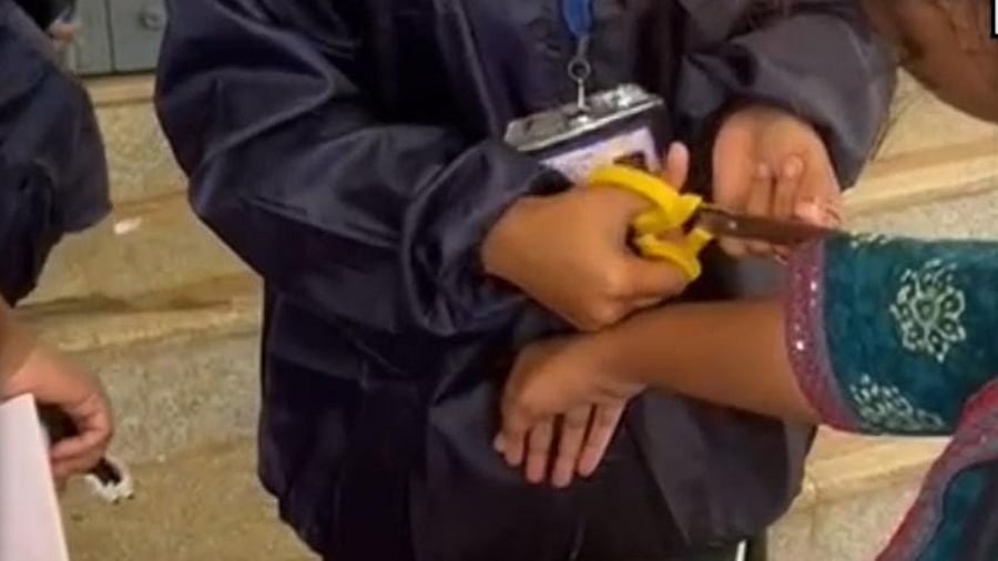 <div class="paragraphs"><p>The examination centre staff cut the sleeves of the dress worn by an aspirant appearing for the exam to fill the posts of PDOs in Hassan on Sunday. </p></div>