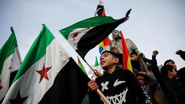 <div class="paragraphs"><p>People celebrate after Syrian rebels announced that they had ousted President Bashar al-Assad, in Majdal Shams</p></div>