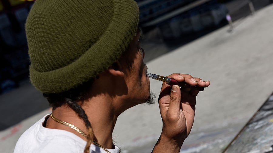 <div class="paragraphs"><p> A young man uses a vaping device. Representative image.</p></div>