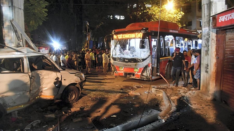 <div class="paragraphs"><p>Security personnel and others gather near the wreckage of vehicles after a BEST bus rammed into pedestrians in Mumbai.</p></div>