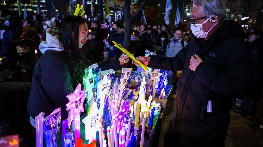 <div class="paragraphs"><p>Protesters attend a rally calling for the impeachment of South Korean President Yoon Suk Yeol, in Seoul</p></div>