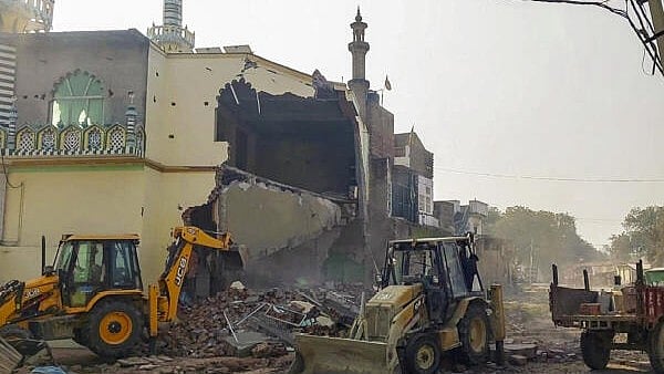 <div class="paragraphs"><p>Bulldozers being used by the Fatehpur district administration in Uttar Pradesh to demolish an allegedly encroached part of the Noori Jama Masjid in Fatehpur, UP, Tuesday.</p></div>