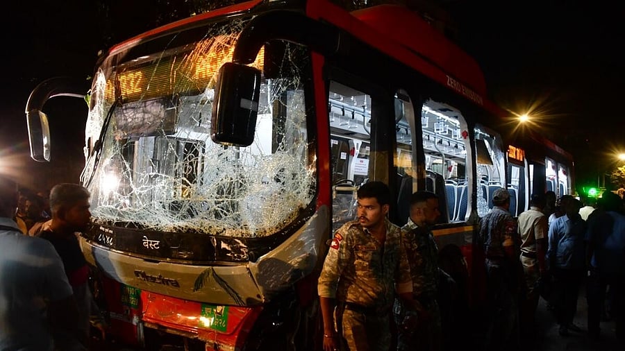 <div class="paragraphs"><p>Security personnel near the damaged Brihanmumbai Electric Supply and Transport (BEST) undertaking's bus after it rammed into pedestrians as well as vehicles on a road at Kurla, in Mumbai, Monday, Dec. 9, 2024.</p></div>