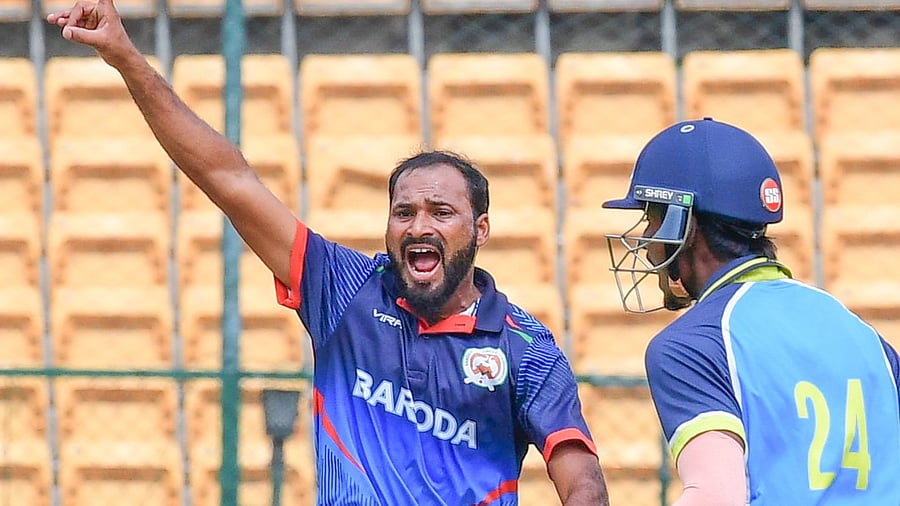 <div class="paragraphs"><p>Baroda's Lukman Meriwala celebrates after scalping a Bengal wicket in the quarterfinals at the M Chinnaswamy Stadium on Wednesday.  </p></div>