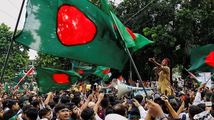 <div class="paragraphs"><p>Students against discrimination wave flags as they join in a rally to mark one month of the end of Awami League regime, at the University of Dhaka, in Dhaka, Bangladesh, September 5, 2024.</p></div>
