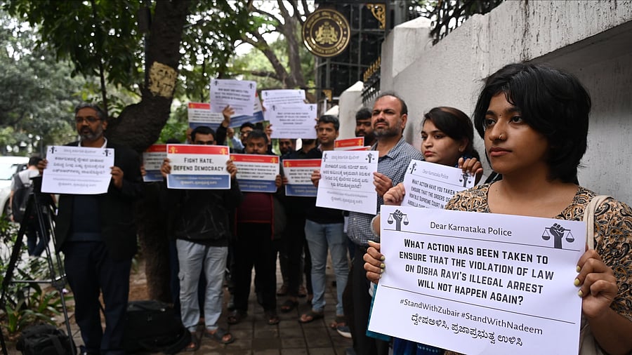 <div class="paragraphs"><p>Activists, advocates, and students holds placards in front of the state police headquarters in Bengaluru on Thursday. </p></div>