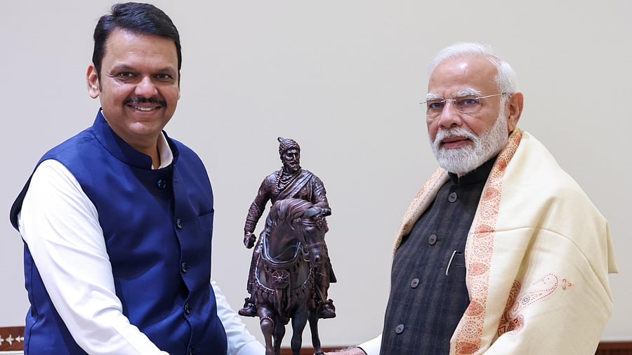 <div class="paragraphs"><p>Devendra Fadnavis with Narendra Modi</p></div>