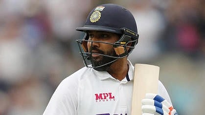 <div class="paragraphs"><p>Rohit Sharma walks after losing his wicket</p></div>