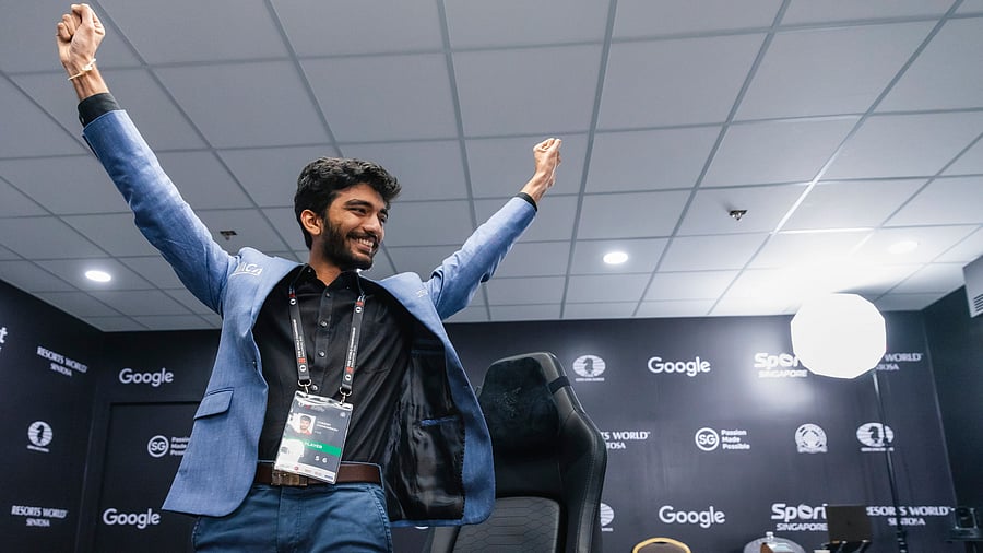 <div class="paragraphs"><p>India’s D Gukesh (right) celebrates his win while title-holder China’s Ding Liren is distraught at the end of Game 14 of the FIDE World Chess Championship in Singapore on Thursday. </p></div>