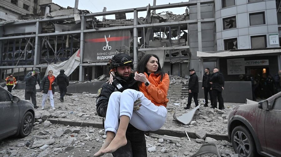 <div class="paragraphs"><p>A police officer carries a woman from a building heavily damaged by a Russian missile strike, amid Russia's attack on Ukraine. Representative image.</p></div>