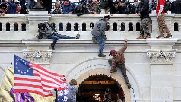 <div class="paragraphs"><p>File photo shows a mob of supporters of Donald Trump fight with members of law enforcement at a door they broke open as they storm the US Capitol Building in Washington.</p></div>