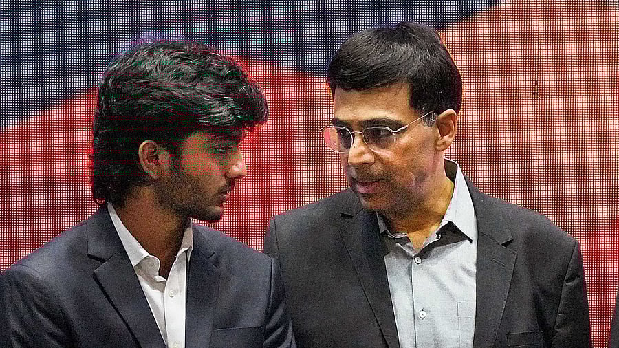<div class="paragraphs"><p>Viswanathan Anand (C) with D Gukesh (L).</p></div>