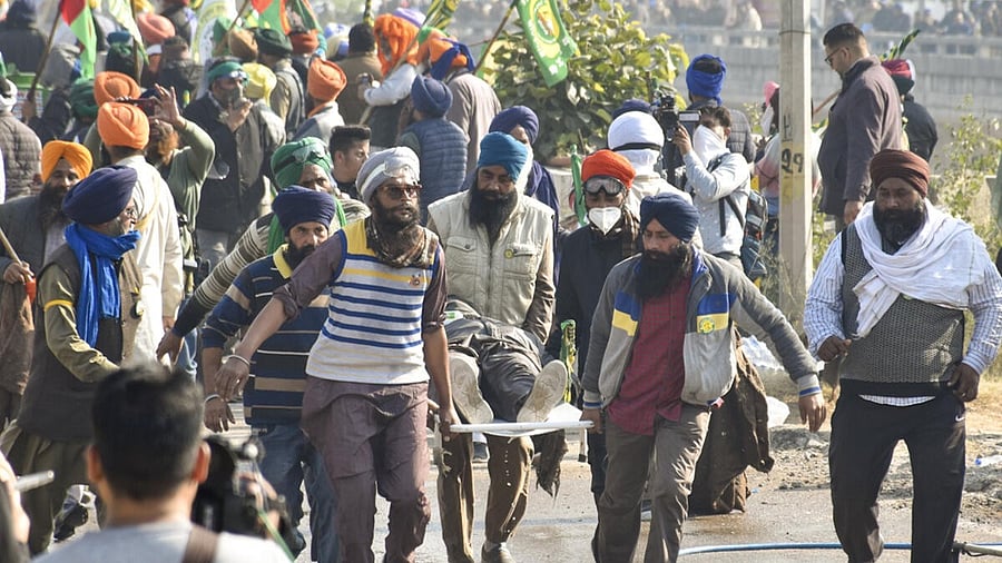<div class="paragraphs"><p>An injured farmer being carried away after security personnel fired tear gas shells to disperse agitating farmers at Shambhu border, in Patiala district, Punjab, Saturday, Dec. 14, 2024. </p></div>