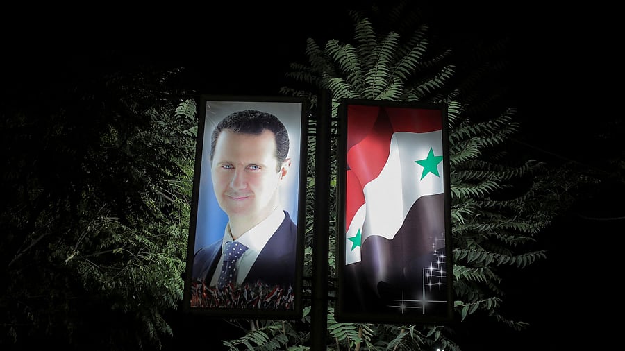 <div class="paragraphs"><p>A picture of Bashar al-Assad is seen at a train station in Damascus, Syria.</p></div>