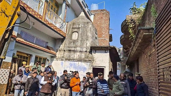 <div class="paragraphs"><p>Police personnel and media during opening of locks of an ancient temple, in Sambhal district, Saturday, Dec. 14, 2024.</p></div>