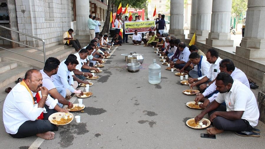 <div class="paragraphs"><p>Members of various organisations consume non-vegetarian food near the DC’s office, in Mandya, on Saturday, demanding serving of non-vegetarian food, as part of the 87th Akhila Bharatiya Kannada Sahitya Sammelana.</p></div>