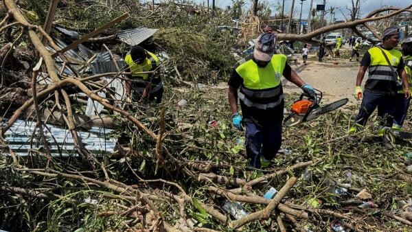 <div class="paragraphs"><p>Rescue workers attempt to clear a blocked road, in the aftermath of Cyclone Chido, within Labattoir, in Mayotte, France, December 15, 2024. </p></div>