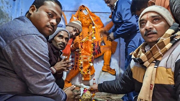 <div class="paragraphs"><p>Devotees offer prayers at Shri Kartik Mahadev Temple (Bhasma Shankar temple) that reopened on December 13 after being shut for 46 years, in Sambhal, UP on Monday.</p></div>