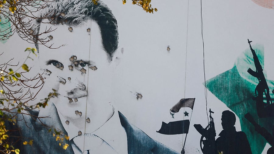 <div class="paragraphs"><p>A billboard with a picture of Syria's Bashar al-Assad shows damage by bullet holes, after the ousting of Syria's Bashar al-Assad, in Damascus, Syria, December 16, 2024. </p></div>