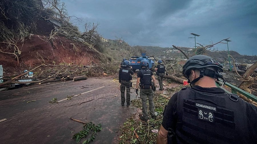 <div class="paragraphs"><p>French Gendarmerie forces stand along a road in the aftermath of Cyclone Chido, in Mayotte, France December 15, 2024.</p></div>