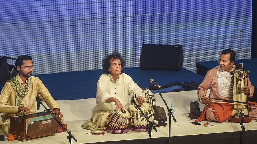 <div class="paragraphs"><p>Tabla maestro Ustad Zakir Hussain performs during a concert</p></div>