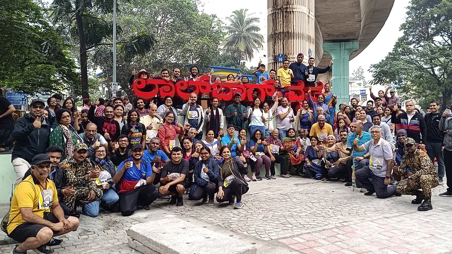<div class="paragraphs"><p>Walkers in Lalbagh with the curator, Arun Pai (seated, far left, in yellow). </p></div>