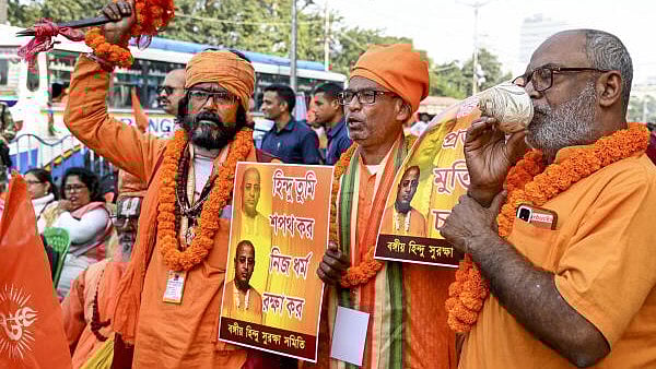 <div class="paragraphs"><p>Monks take part in a rally on the occasion of 'Vijay Diwas', to protest against the alleged atrocities over Hindu minorities in Bangladesh, in Kolkata, Monday.&nbsp;</p></div>