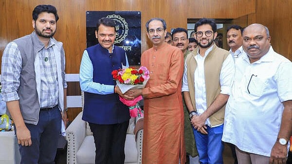 <div class="paragraphs"><p>Devendra Fadnavis with Shiv Sena (UBT) chief Uddhav Thackeray, party MLA Aaditya Thackeray and other leaders during a meeting on Tuesday.</p></div>