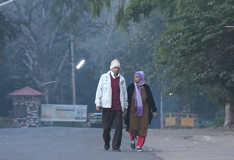 <div class="paragraphs"><p>Senior citizens wearing sweaters and caps take a walk during the winter morning in Dharwad on Tuesday. </p></div>