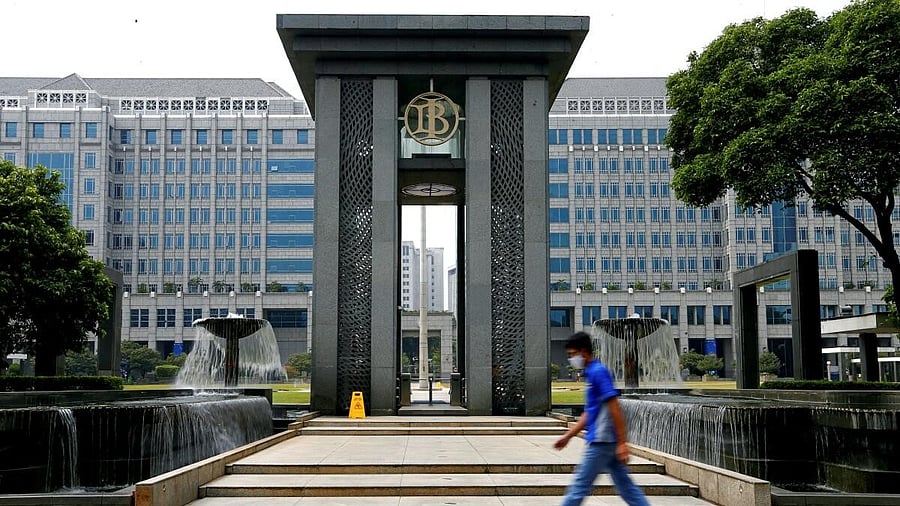 <div class="paragraphs"><p>A man walks past Bank Indonesia headquarters.</p></div>