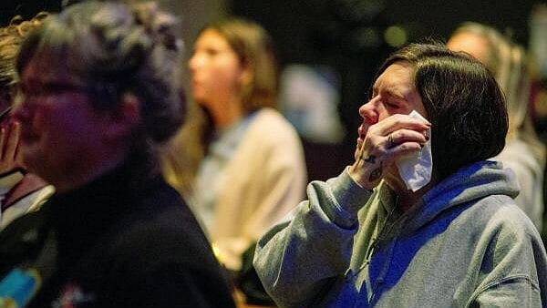<div class="paragraphs"><p>Worshipers at Blackhawk Church gather to pray for victims and survivors of a shooting at Madison's Abundant Life Christian School, in Middleton, Wisconsin, US.</p></div>