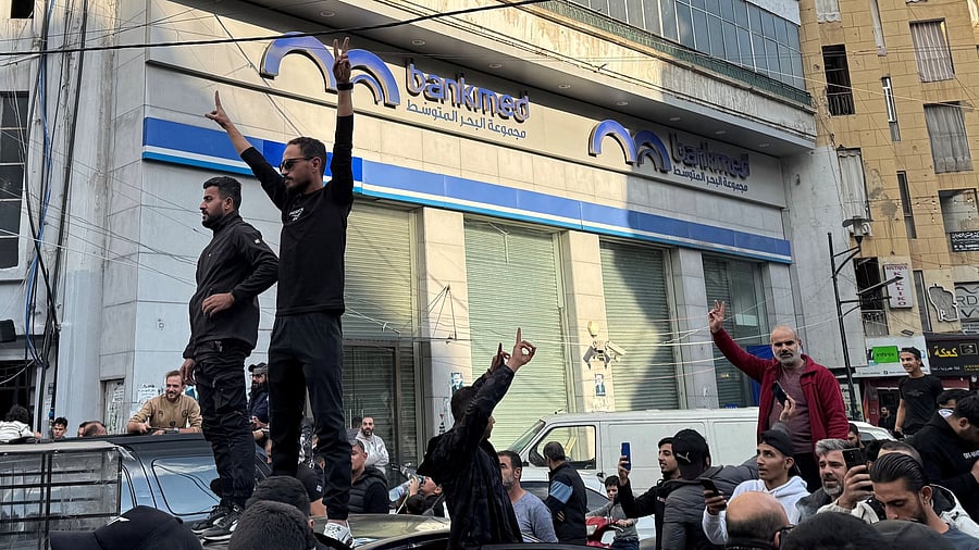 <div class="paragraphs"><p>People celebrate, after Syrian rebels announced that they have ousted Syria's Bashar al-Assad, in Beirut, Lebanon December 8, 2024. </p></div>