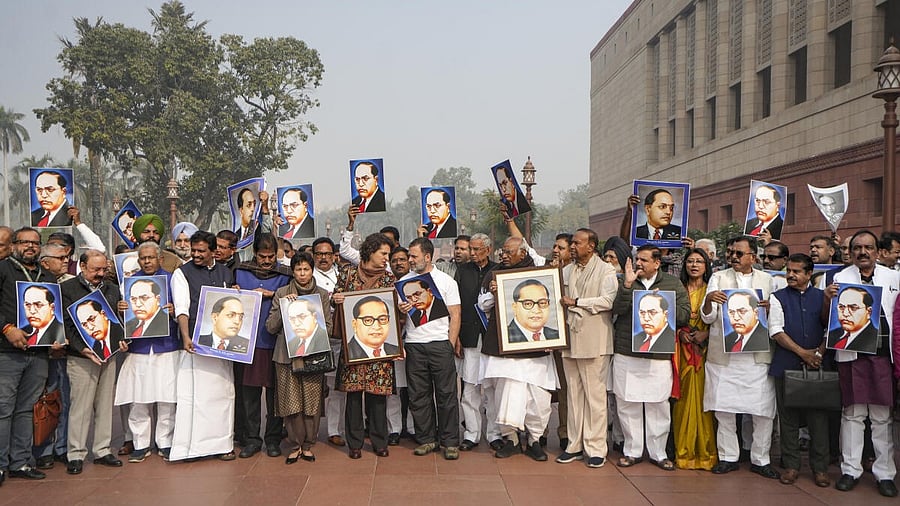 <div class="paragraphs"><p>Leaders hold portraits of Dr B R Ambedkar during a protest amid the Winter session of Parliament, in New Delhi.</p></div>