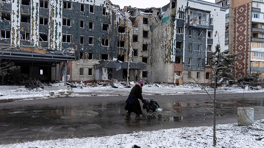<div class="paragraphs"><p>A woman walks past a building damaged by a Russian military strike, amid Russia's attack on Ukraine, in the town of Pokrovsk in Donetsk region, Ukraine December 12, 2024. </p></div>