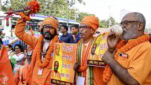 <div class="paragraphs"><p>Monks take part in a rally on the occasion of 'Vijay Diwas', to protest against the alleged atrocities over Hindu minorities in Bangladesh, in Kolkata.</p></div>