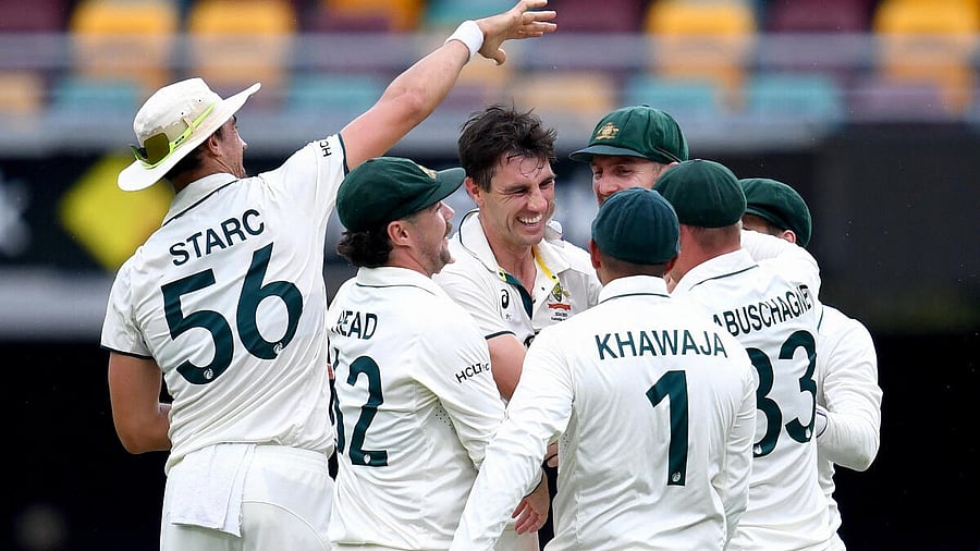 <div class="paragraphs"><p>Third Test - Australia v India - Brisbane Cricket Ground, Brisbane, Australia - December 17, 2024 Australia's Pat Cummins celebrates after taking a wicket with teammates.</p></div>