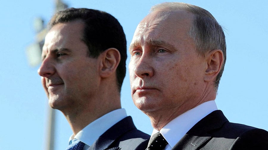 <div class="paragraphs"><p>Russian President Vladimir Putin  and former Syrian President Bashar al-Assad </p></div>