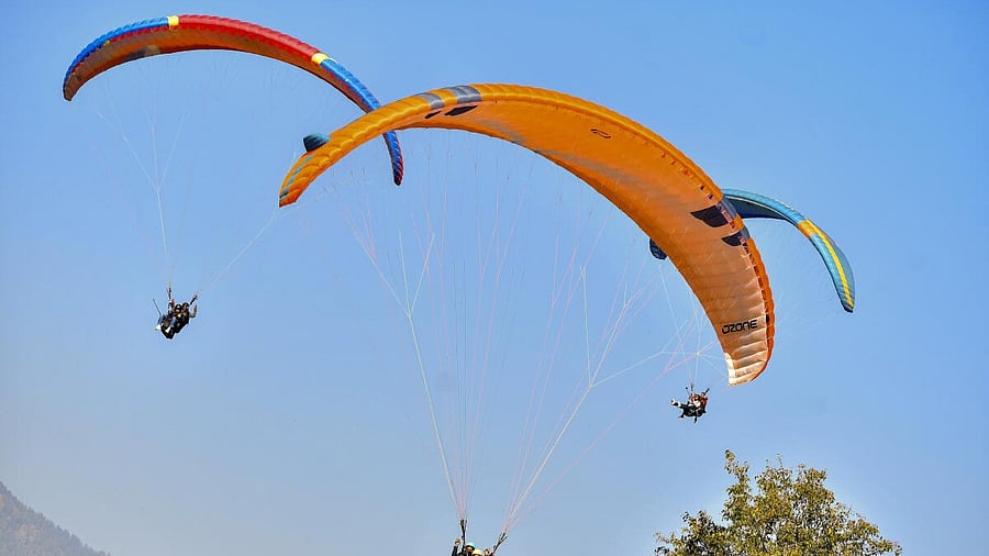 <div class="paragraphs"><p>Tourists paraglide on a clear day, in Manali.</p></div>
