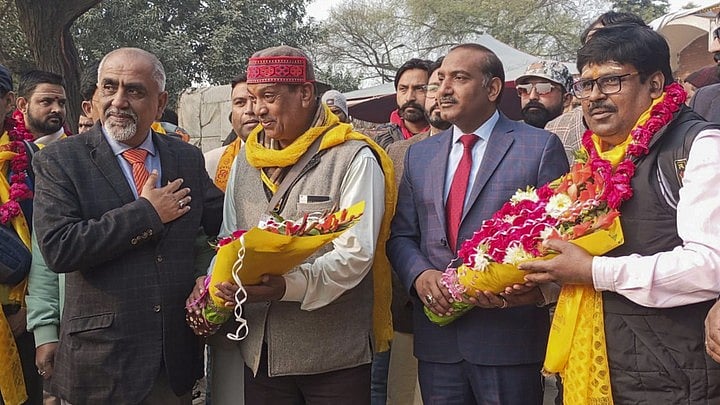 <div class="paragraphs"><p>Pakistan Hindu Temple Management Committee President Krishna Sharma and others receive Hindu pilgrims upon the latter’s arrival to offer prayers at Katas Raj temples in Pakistan's Punjab province, in Lahore.</p></div><div class="paragraphs"><p><br></p></div>