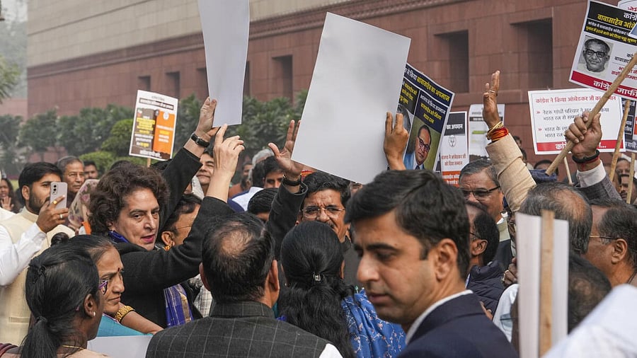 <div class="paragraphs"><p>I.N.D.I.A. bloc members, including Congress MP Priyanka Gandhi  and NDA members hold posters and raise slogans during a protest in Parliament premises on Thursday.</p></div>