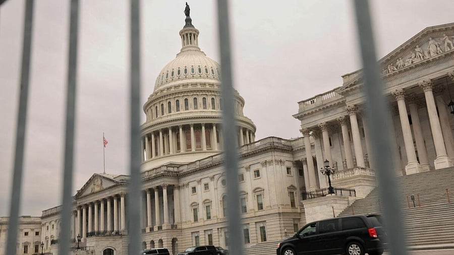 <div class="paragraphs"><p>The dome of the Capitol is seen through a security fence on a day where a potential government shutdown looms during the holidays after a spending bill backed by Donald Trump failed in the U.S. House of Representatives</p></div>