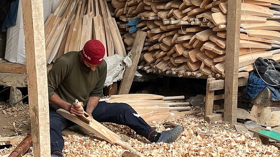 <div class="paragraphs"><p>A worker smoothens a cricket bat using a block plane (randha) at F2 Sports, a bat manufacturing unit located in Kashmir’s Anantnag district.</p></div>