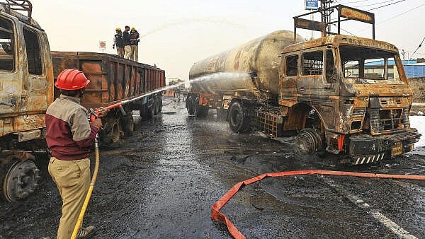 <div class="paragraphs"><p>Firefighters douse the fire at the site of the accident after a truck loaded with a chemical collided with some other vehicles and caught fire on the Jaipur-Ajmer Highway, in Jaipur, on Friday.</p></div>