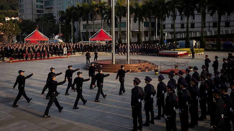 <div class="paragraphs"><p>Security forces march during the flag raising ceremony in China.</p></div>